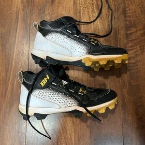 Under Armour Black and White Cleats with Gold Accents